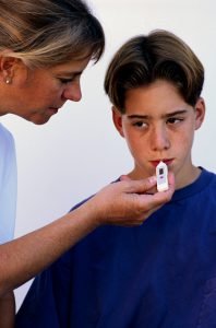 A mother checking her child's temperature