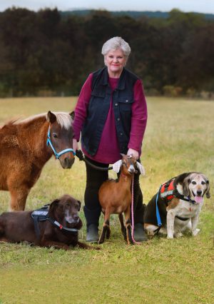 Cindy Quattlebaum with multiple animals.