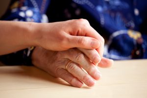 Two people holding hands.