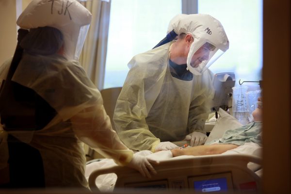 Dr. Matthew Day takes care of a patient in Lexington Medical Center's Critical Care Unit.