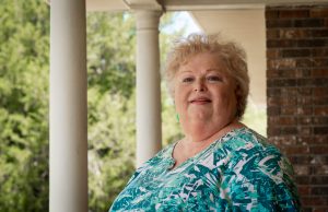 Patient Debra Allen, on her front porch.