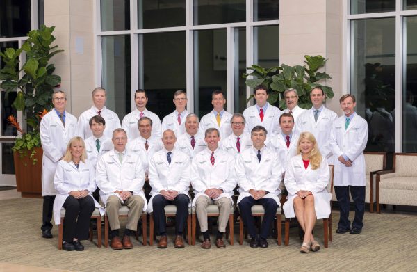 Professional group shot of 20 heart and vascular doctors in white lab coats