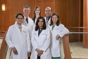 Doctors at Lexington Rheumatology pose in the practice's lobby.