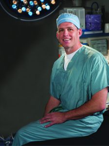 Head shot of Jeffrey A. Travis, MD in scrubs