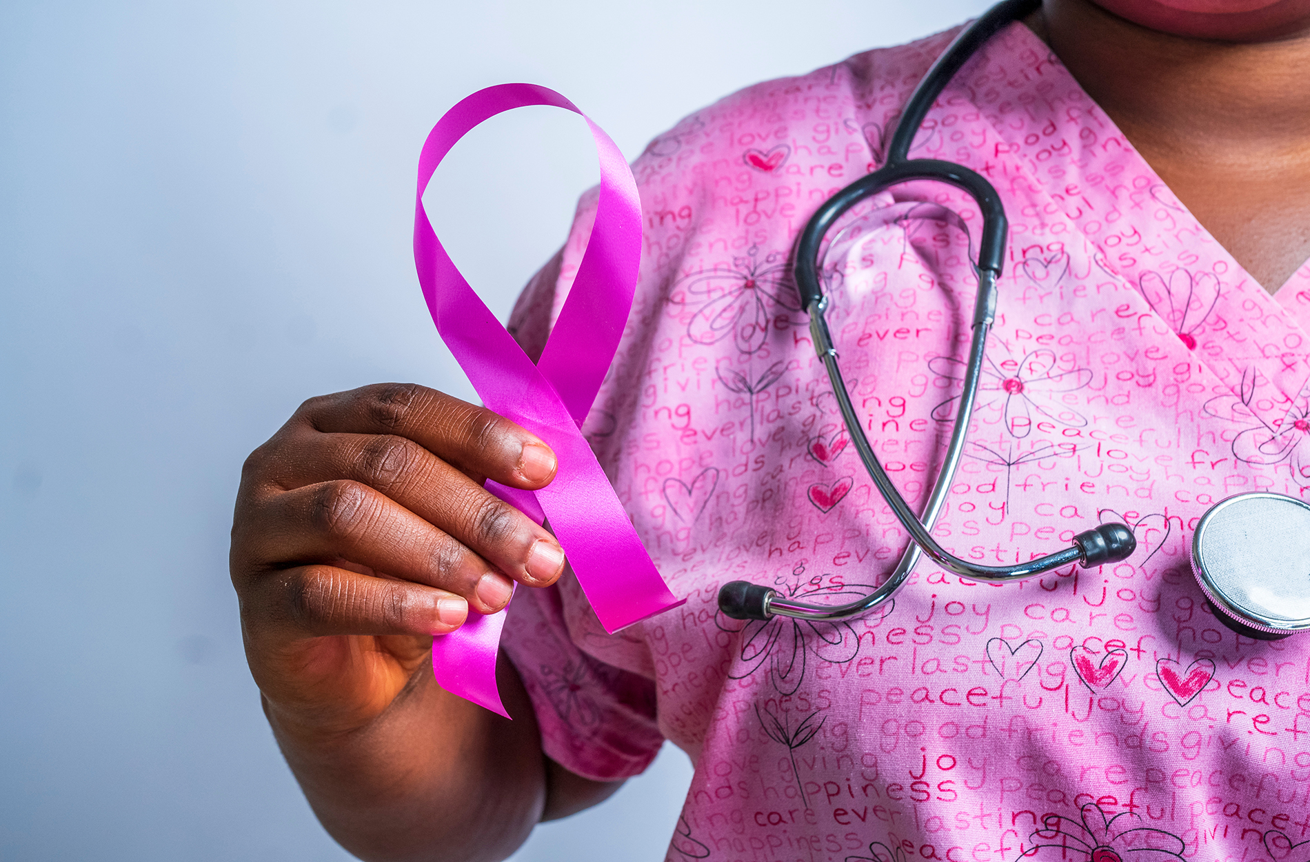 Female Health Provider Holding Pink Ribbon