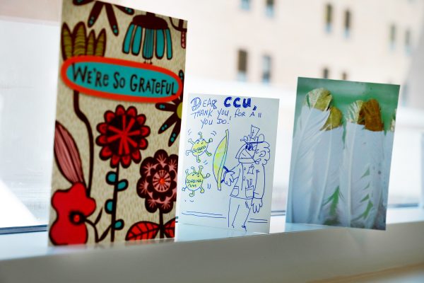 A set of colorful get-well-soon cards on a windowsill.