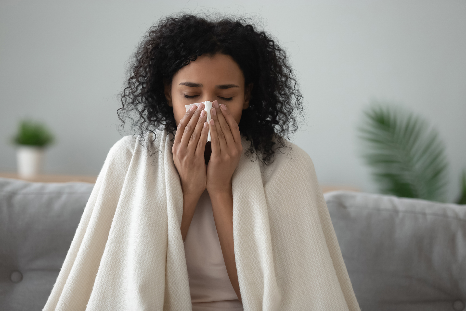 Woman sick in bed with flu