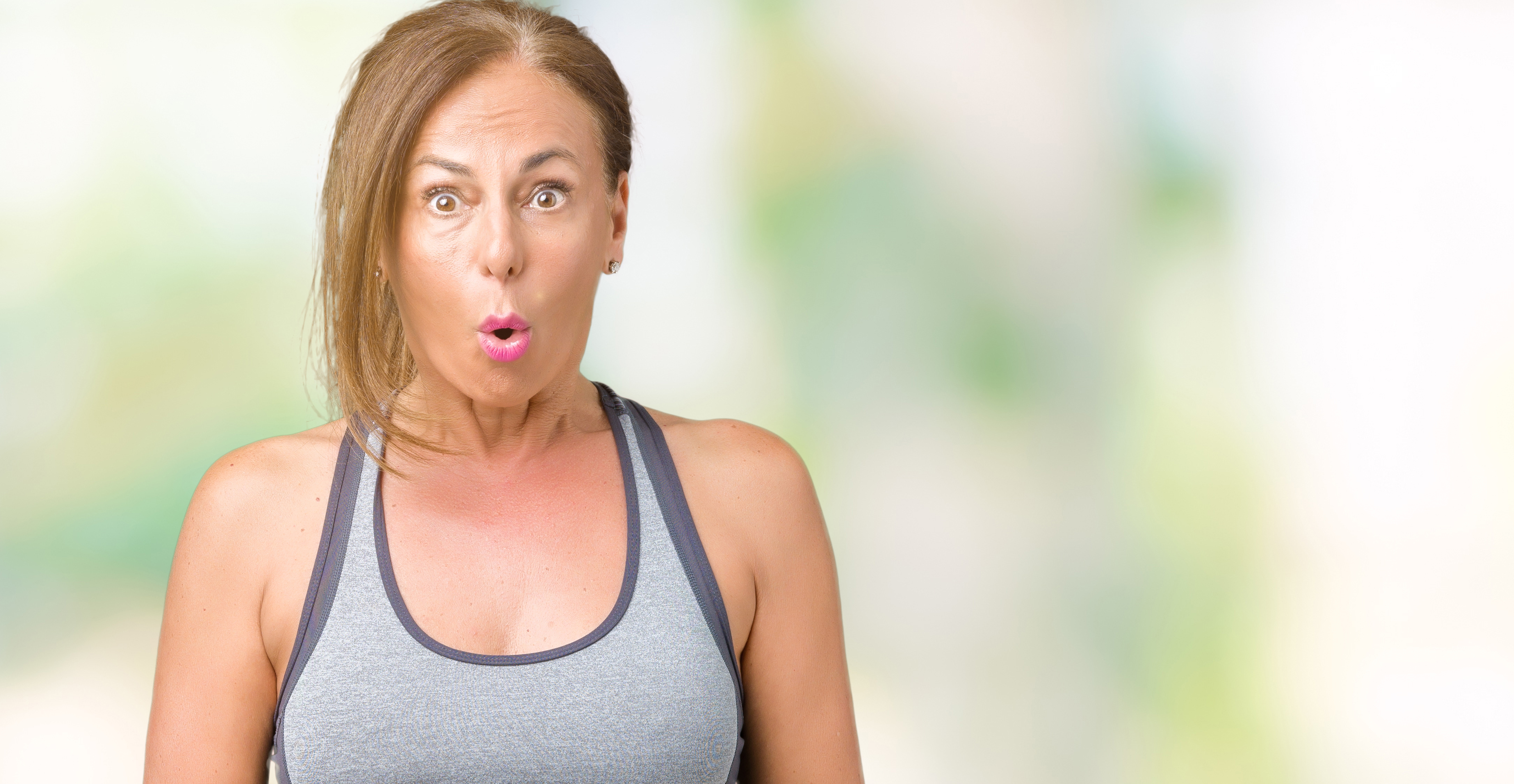 Woman in exercise looking surprised and worried