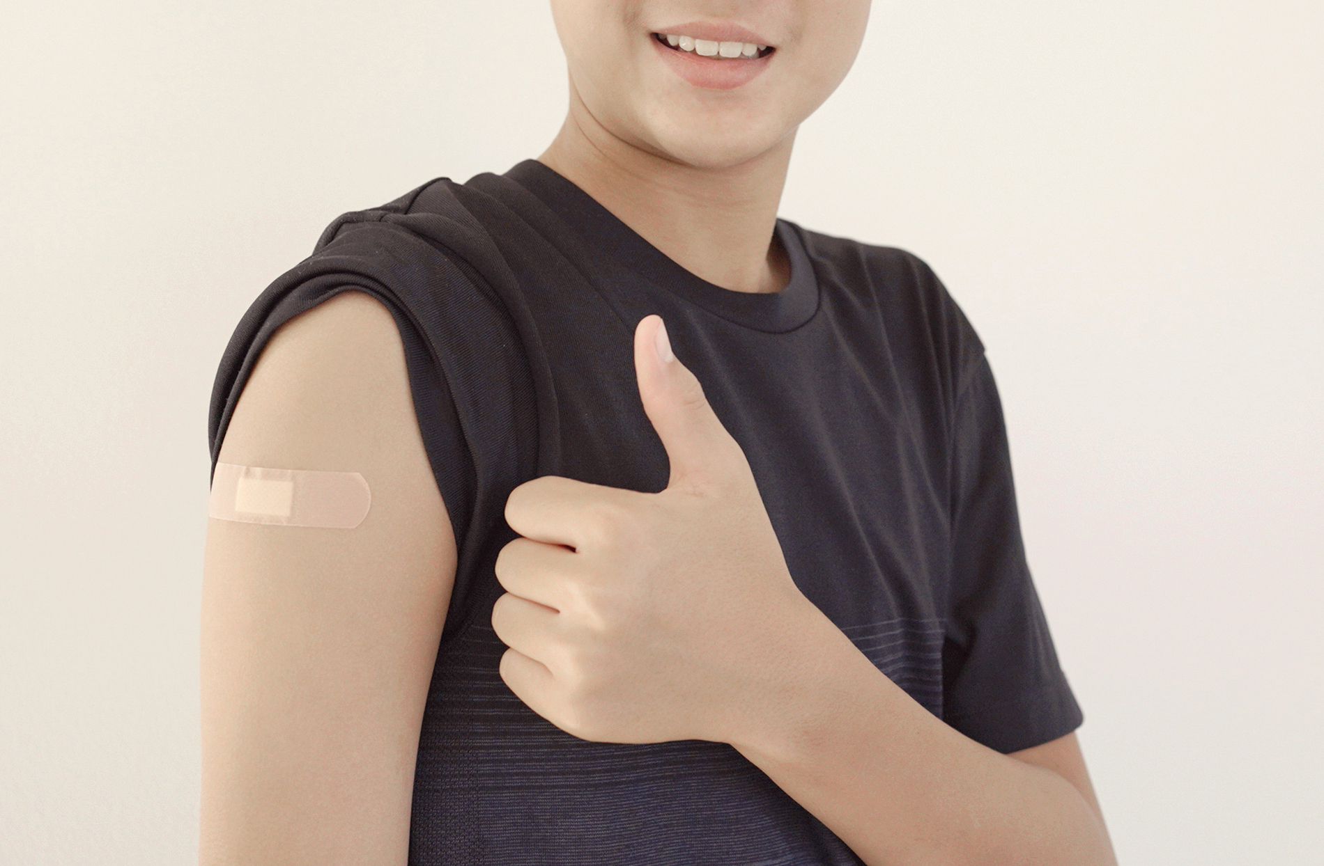 Boy with bandage on shoulder