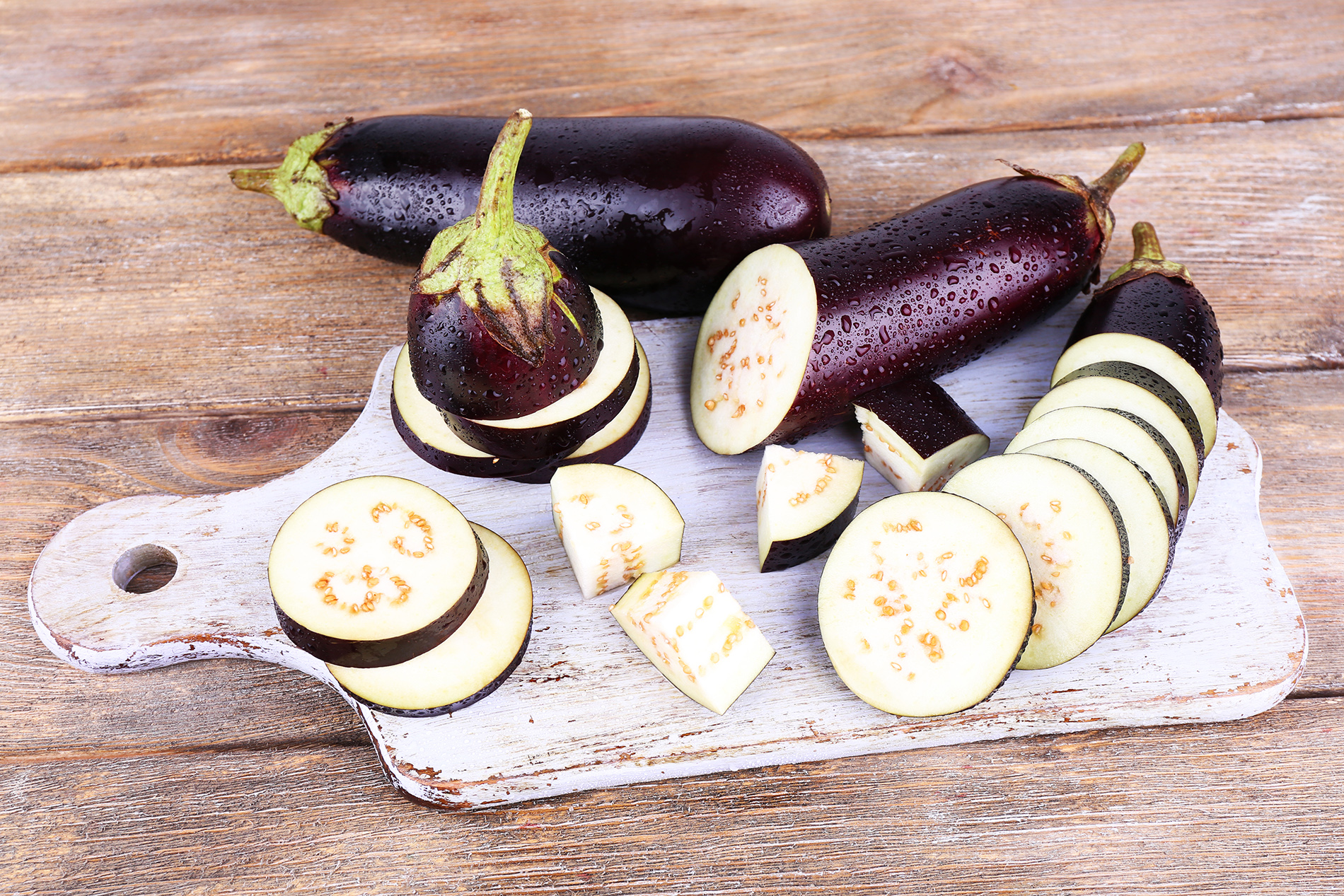Sliced eggplant on cutting board
