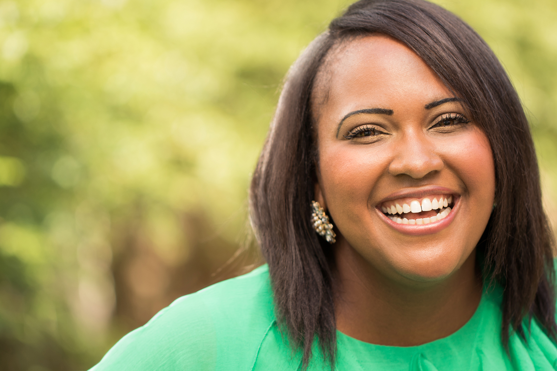 Beautiful young black woman in green sweater