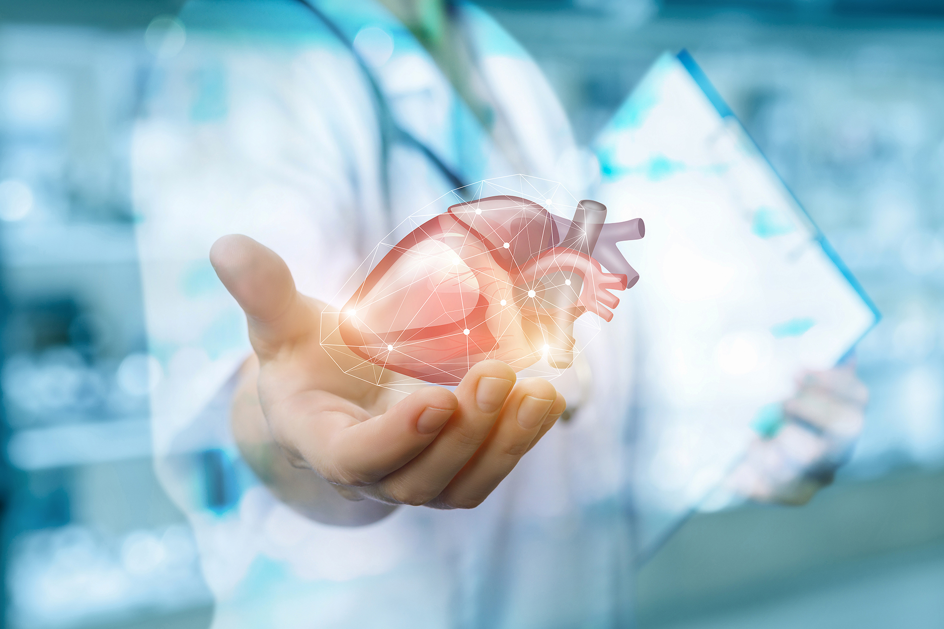 Surgeon holding abstract illustration of a heart