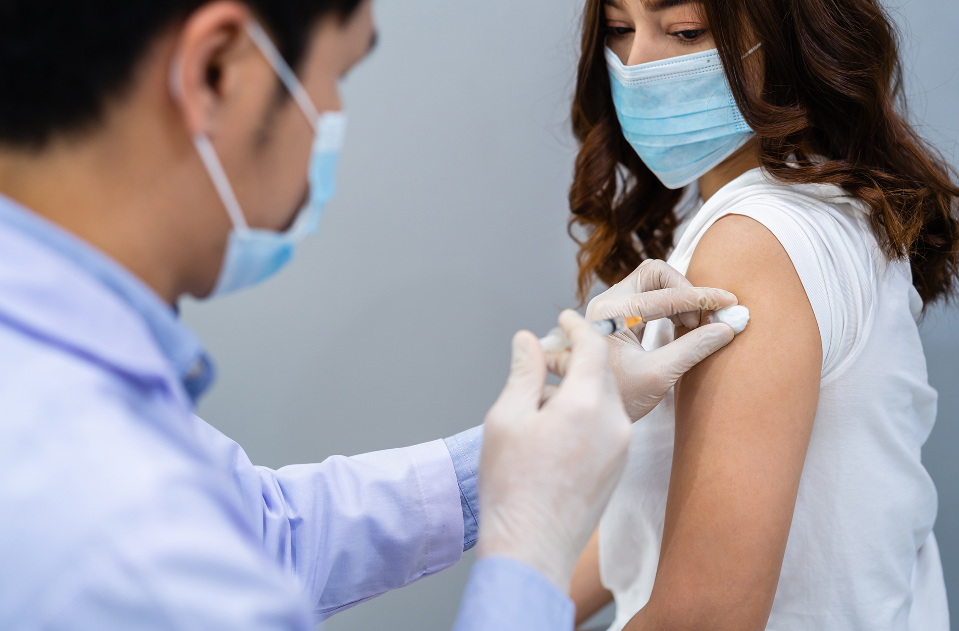 Woman receiving vaccine injection
