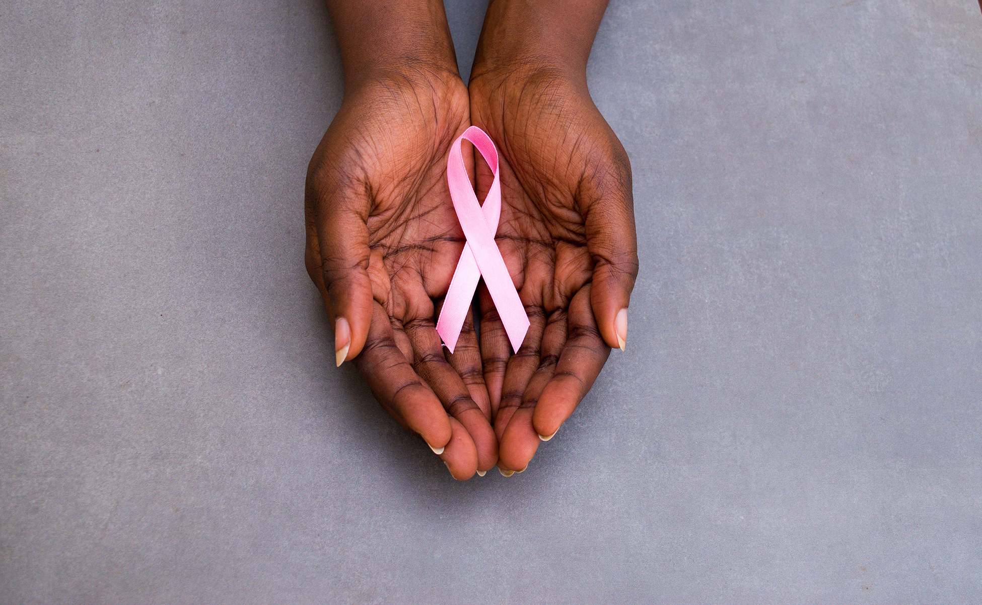Woman's Handing Holding Pink Breast Cancer Ribbon