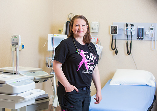 Libby in Urgent Care wearing Faith over Fear t-shirt
