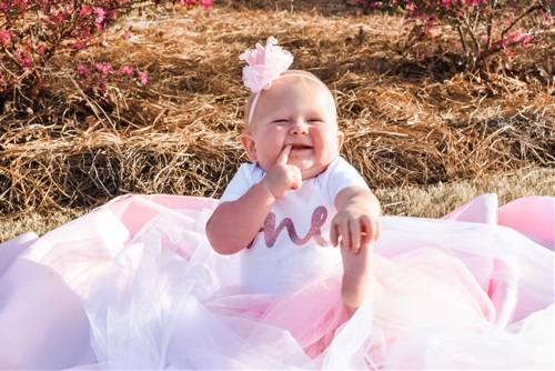 Baby in 1st birthday outfit