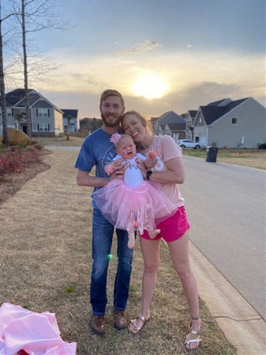 Family standing in neighborhood