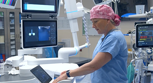 Dr. Heather Currier in operating room using ION equipment