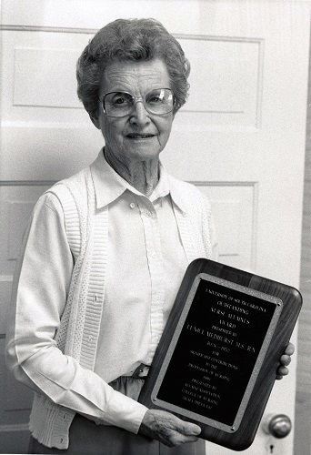 Later photo of Ms. Medhurst receiving award