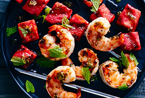 Shrimp and watermelon kebabs on grill