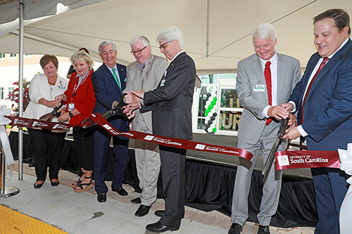 University of South Carolina and Lexington Medical Center leaders cutting ribbon on College on Nursing satellite campus