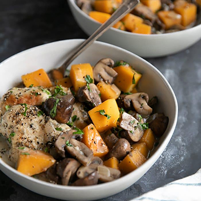 Bowl of chicken, squash and mushrooms