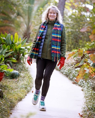 Mary Green Brush walking on path in woods