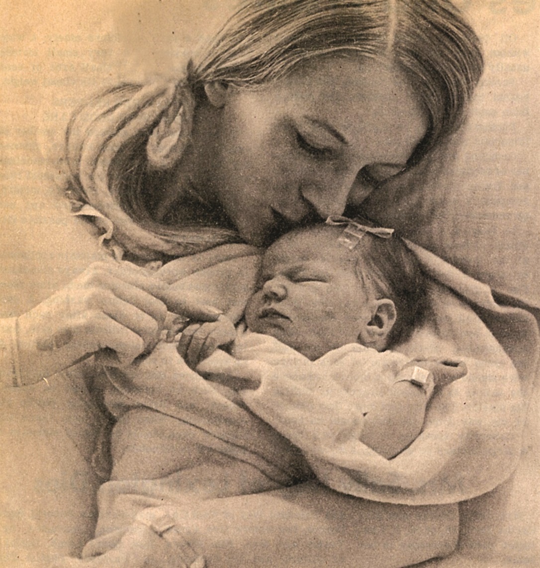 Windy's mother holding Windy at birth in 1971